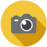 Illustration of a gray camera on a yellow background.