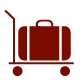 Red luggage cart with a suitcase on it