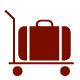 An illustration of a red luggage cart with a suitcase on it. 