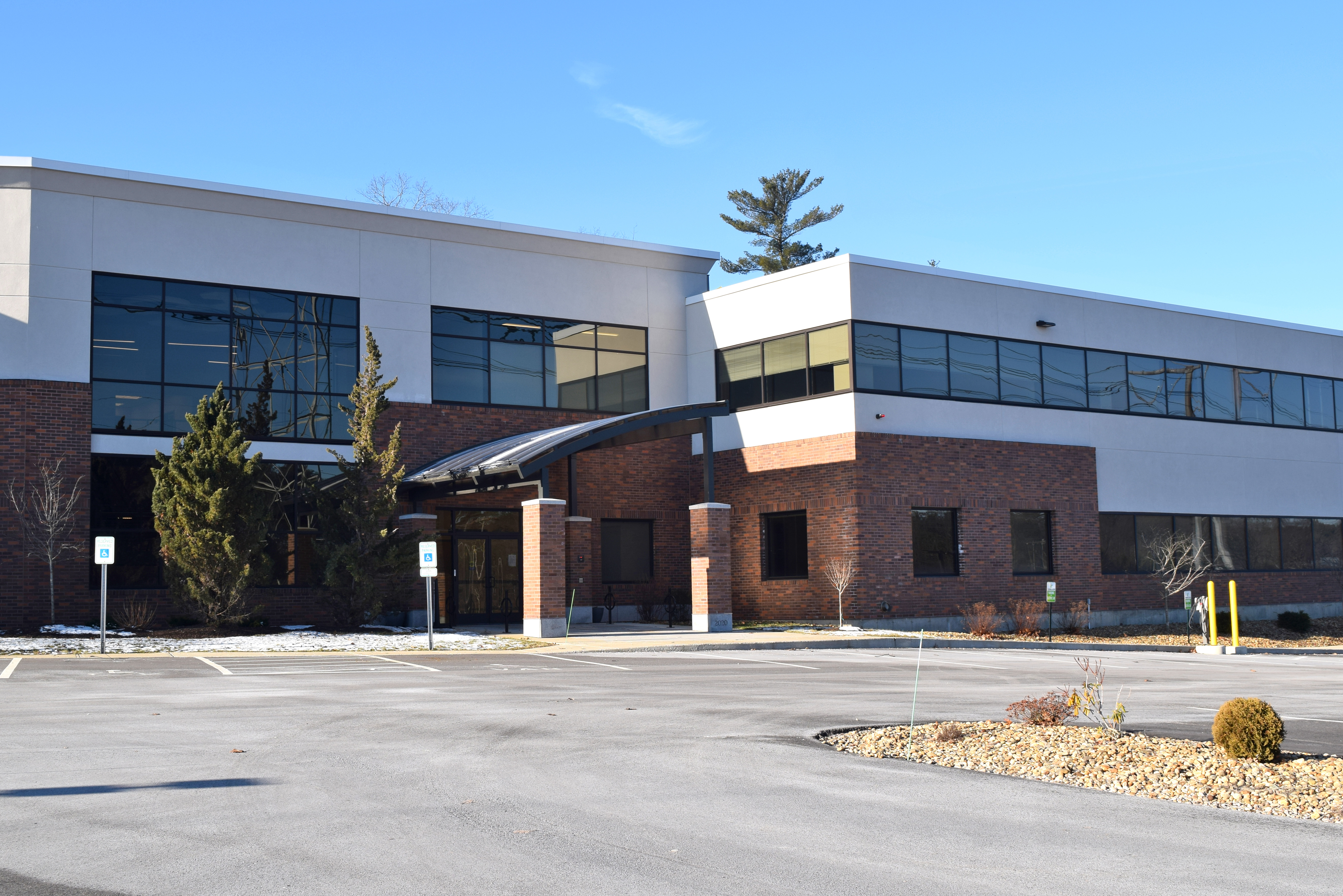 A building with an empty parking lot.
