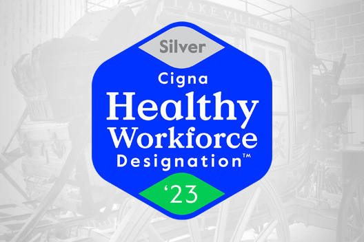 Cigna Health Workforce Designation logo in front of a stage coach.