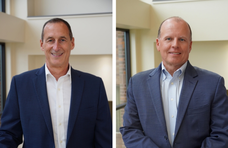 two individuals wearing a suite